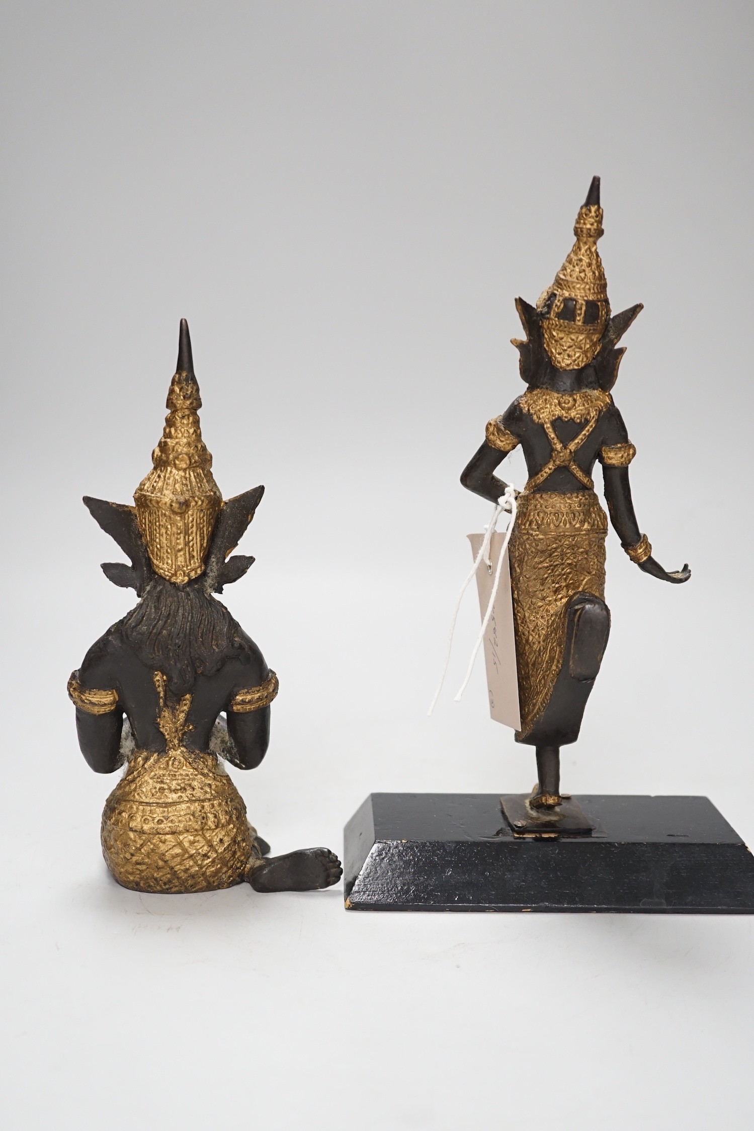 Two two colour Thai patinated metal figures and a hollow cast leopard. Tallest 25cm